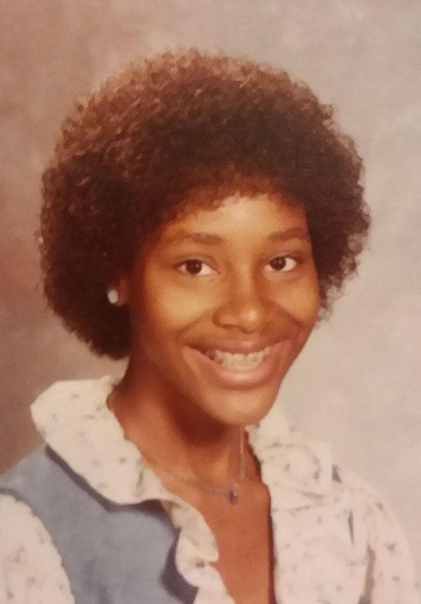 Janice as a teen with a jheri curl